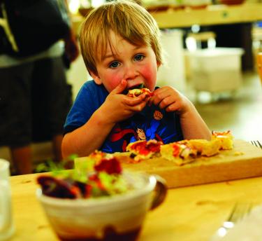 Child eating pizza